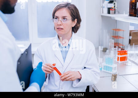 Chemists working on the analysys in the lab together. Stock Photo