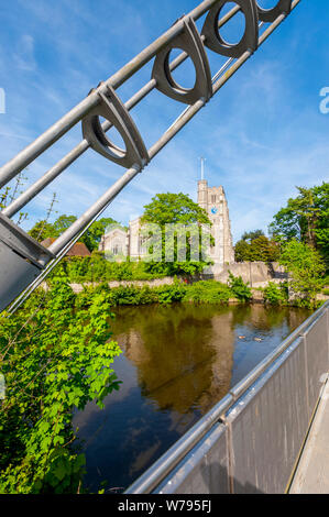 All Saints Church, Maidstone on the banks of the Meday on a sunny spring day. From Lockmeadow Footbridge Stock Photo