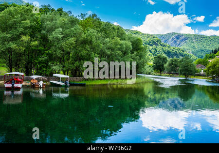 Montenegro, Many boats anchoring at riverside of crnojevica river in cetinje town waiting for tourists to do boat trip to skadar lake in national park Stock Photo