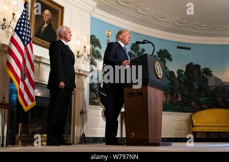 Washington, United States Of America. 05th Aug, 2019. U.S President Donald Trump joined by Vice President Mike Pence, left, delivers remarks on the mass shootings in El Paso and Dayton from the Diplomatic Reception Room of the White House August 5, 2019 in Washington, DC. Credit: Planetpix/Alamy Live News Stock Photo