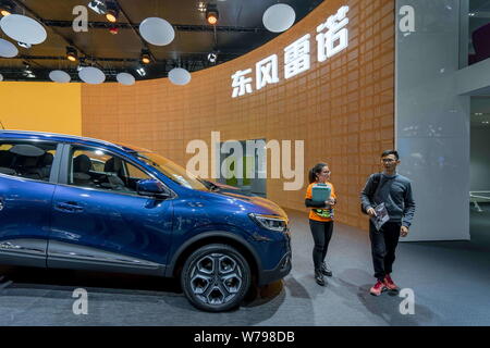 --FILE--People visit the stand of Dongfeng Renault during the 14th China (Guangzhou) International Automobile Exhibition, also known as Auto Guangzhou Stock Photo