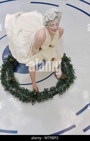 An eight-meter-tall sculpture of American actress and model Marilyn Monroe, frozen with her dress blowing up, is on display at a shopping mall in Dali Stock Photo