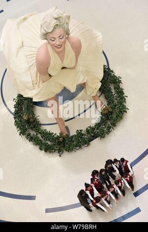 An eight-meter-tall sculpture of American actress and model Marilyn Monroe, frozen with her dress blowing up, is on display at a shopping mall in Dali Stock Photo