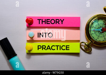 Theory Into Practice text on sticky notes isolated on office desk Stock Photo