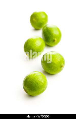 The green limes isolated on white background. Stock Photo