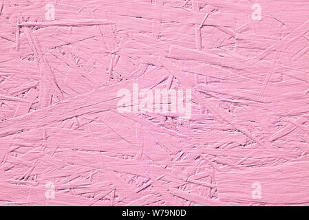 Bright pink texture of wood chipboard close-up Stock Photo