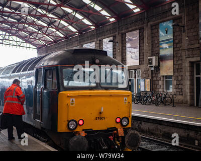 A train driver checks his GWR class 57 diesel locomotive at Penzance Railway Station, Cornwall Stock Photo
