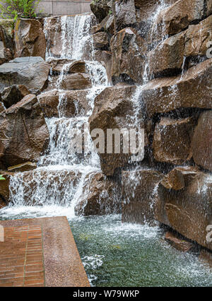Waterfall Over Brown Stones Stock Photo