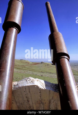 Looking between gun turrets of the Oz 77 Memorial toward the Valley of Tears and into Syria. Stock Photo