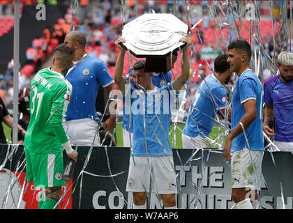 Wembley Stadium, Wembley, UK. 4th Aug, 2019. FA Community Shield Final football; Liverpool versus Manchester City; Phil Foden of Manchester Cty celebrates with the FA Community Shield after defeating Liverpool on penalties at 5-4 Credit: Action Plus Sports/Alamy Live News