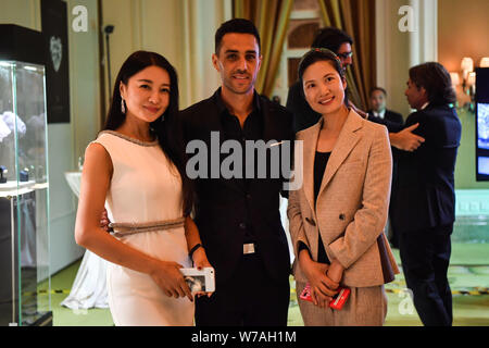 Israeli football player Eran Zahavi, center, of Guangzhou R&F, attends a promotional event for a diamond brand in Guangzhou city, south China's Guangd Stock Photo