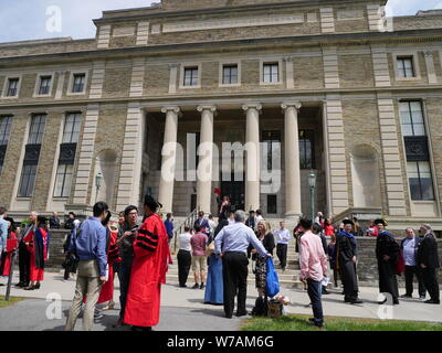 Ithaca, NY - graduates and their friends at the graduation ceremony at Cornell University Stock Photo
