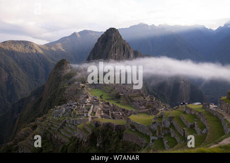 cloud around Machu Picchu in early morning hours Stock Photo