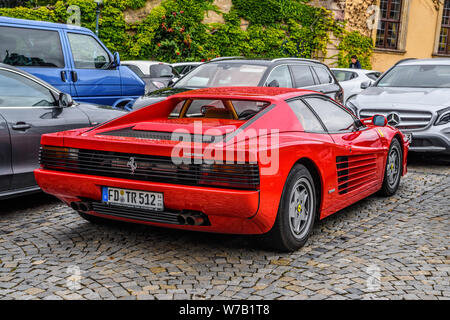 GERMANY, FULDA - JUL 2019: red FERRARI TESTAROSSA Type F110 coupe is a 12-cylinder mid-engine sports car manufactured by Ferrari, which went into prod Stock Photo