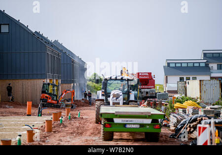 Helgoland, Germany. 17th July, 2019. Several houses in which almost 70 new apartments are being built are being completed on the North Sea island of Helgoland near the lighthouse. The new apartments are designed for singles and families. It is to become affordable living space on the Oberland for a good 160 people. Credit: Axel Heimken/dpa/Alamy Live News Stock Photo