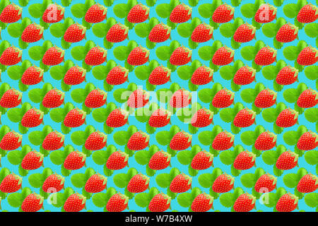 Fruit pattern. Colorful fresh strawberries texture slices on light blue pastel background. From top view. Stock Photo