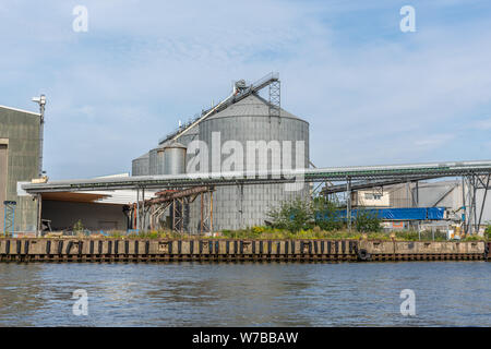 an old grain silos  are located in a transhipment port Stock Photo