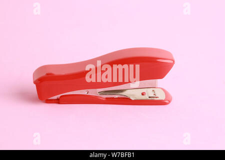 red stapler in color background Stock Photo