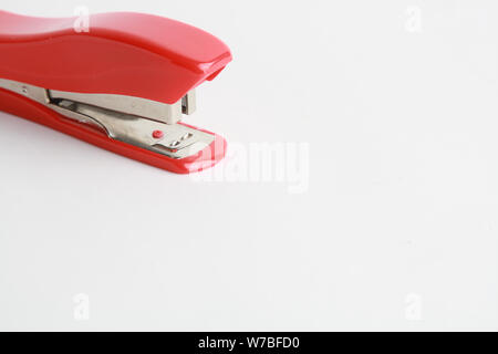 red stapler on white background Stock Photo
