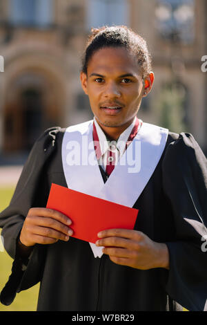 Worried boy going to make a speech during graduation ceremony. Stock Photo