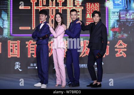 Chinese actor Feng Shaofeng, left, and actress Liu Yifei, second left, attend a press conference for their movie 'Hanson And The Beast' in Beijing, Ch Stock Photo