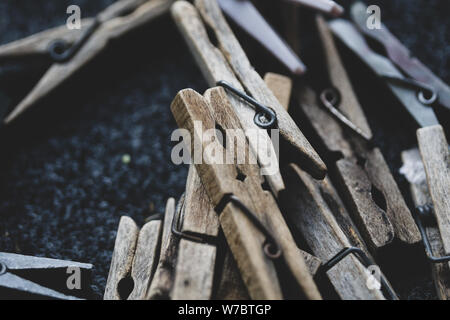 Details with a stack of plastic and wooden clothes pegs Stock Photo