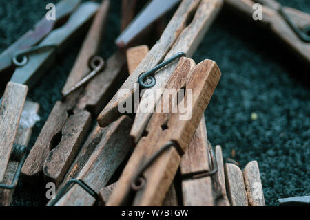 Details with a stack of plastic and wooden clothes pegs Stock Photo