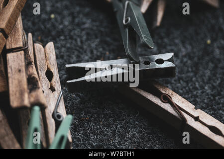 Details with a stack of plastic and wooden clothes pegs Stock Photo