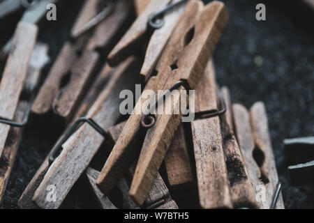 Details with a stack of plastic and wooden clothes pegs Stock Photo