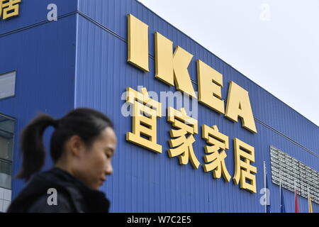 --FILE--A Chinese woman walks past a furnishing store of IKEA in Beijing, China, 17 October 2017.   Furniture giant IKEA has pulled a Chinese TV comme Stock Photo
