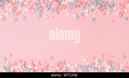 Colorful Pastel Sprinkles on pink background, top view, copy space. Sweet  cake pastry ingredient, holiday birthday concept, creative border Stock  Photo - Alamy