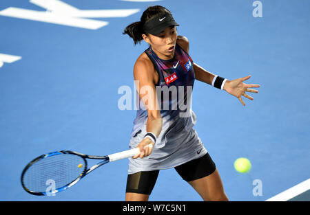 Zhang Shuai of China returns a shot to Kurumi Nara of Japan in their first round match of women's singles during 2017 WTA Hong Kong Tennis Open in Hon Stock Photo