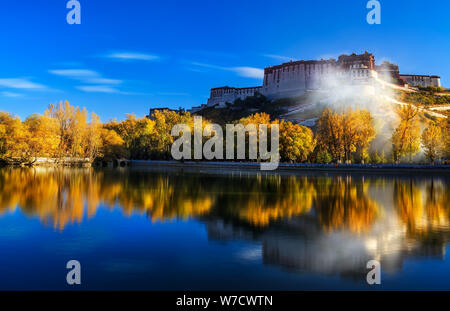 --FILE--Landscape of the Potala Palace in Lhasa, southwest China's Tibet Autonomous Region, 19 October 2017.   More than 100 major tourist attractions Stock Photo