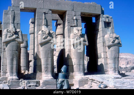 Colossal statues of the Pharaoh at the Ramesseum temple in Thebes near ...