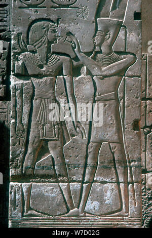 Relief of Rameses III receiving blessing of Amon-Ra, Mortuary Temple, Medinet Habu, 12th centuryBC. Artist: Unknown Stock Photo