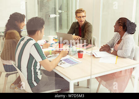 Delighted young people talking about their exams Stock Photo