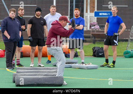 Rookies being coached at British american football team Ipswich Cardinals Stock Photo