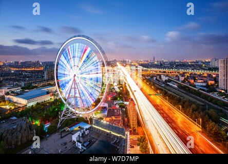 Night view of a ferris wheel at an amusement park in Puxi in Shanghai, China, 11 August 2016. Stock Photo