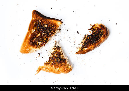 slice of toasted bread burned and teared apart, isolated Stock Photo