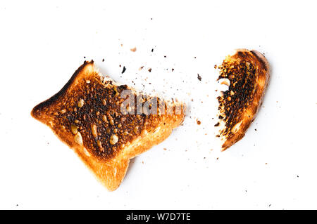 slice of toasted bread burned and teared apart, isolated Stock Photo