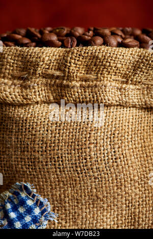 Burlap sack with coffee beans close-up. Stock Photo