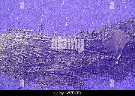 Texture of an old painted wall of purple color closeup. Abstract background Stock Photo