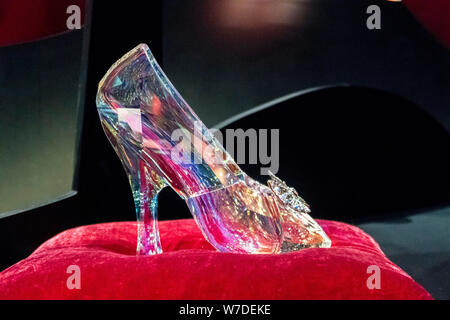Cinderella's glass shoes in the style of chopines shiny glossy transparent  detailed in fantasy background 4k on Craiyon