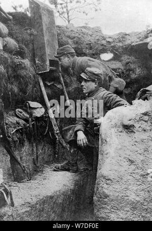 The periscope in use in a French trench, First World War, 1914-1918, (c1920). Artist: Sphere Stock Photo