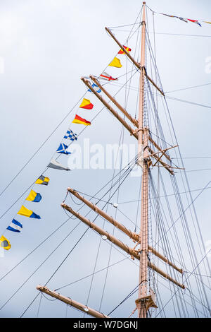 Ship's mast with pennants Stock Photo