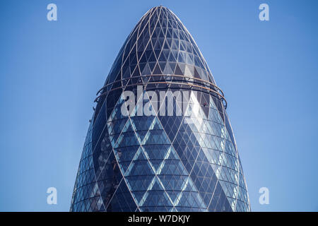 30 St Mary Axe (informally known as The Gherkin and previously as the Swiss Re Building) is a commercial skyscraper in London Stock Photo
