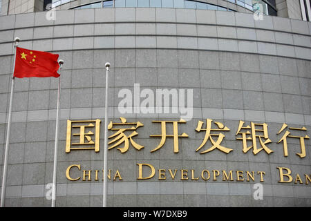 --FILE--A Chinese national flag flutters in front of the China Development Bank Tower in Lujiazui Financial District in Pudong, Shanghai, China, 11 Ma Stock Photo