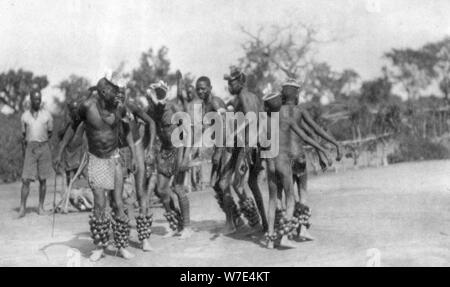 Ugandan dancers, Dodoma to Mongalla, Uganda, 1925 (1927). Artist: Thomas A Glover Stock Photo