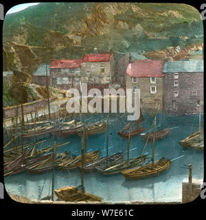 Fishing boats in the harbour, Polperro, Cornwall, late 19th or early 20th century. Artist: Church Army Lantern Department Stock Photo