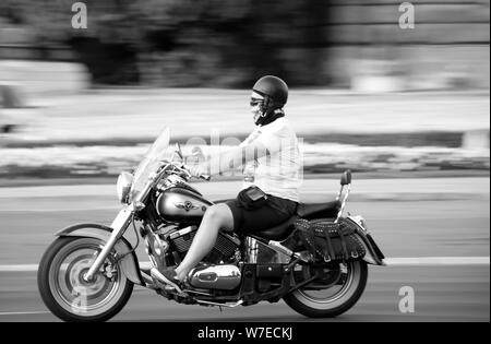 Belgrade, Serbia - July 30, 2019: One man riding a chopper motorbike on a summer day, in black and white Stock Photo